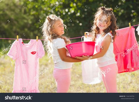 Two Little Girls Laundring Sisters Doing Stock Photo 1164100759