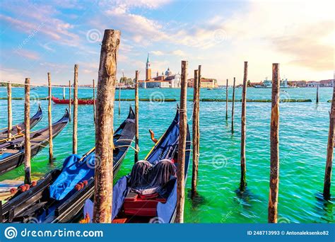 San Giorgio Maggiore Island And Traditional Gondolas Moored In The