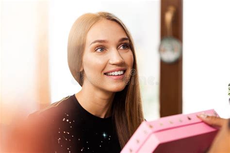Surprised Young Woman Opens A Pink Box With A Present Stock Image Image Of Indoor