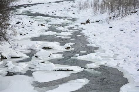 Frozen Fast Mountain River In Winter Spring Melting Of Ice Springtime