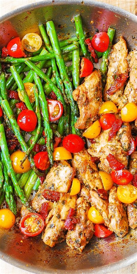 one pan pesto chicken and veggies sun dried tomatoes asparagus cherry tomatoes healthy