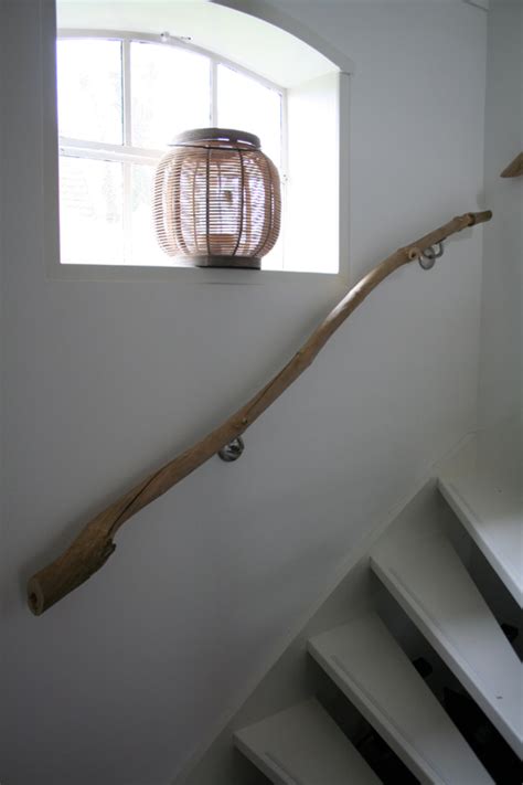 You can see our first living room makeover here and the more recent one here. handrail made from branches | THE STYLE FILES