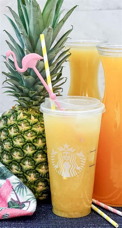 Pineapple Orange Juice And Straws On A Table