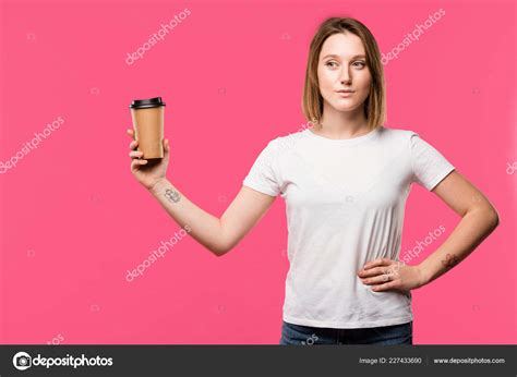 Pretty Tattooed Girl Showing Disposable Cup Coffee Isolated Pink