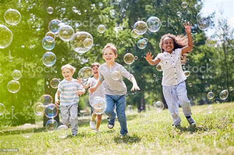 Little Kids Having Fun Outdoors Stock Photo - Download Image Now - iStock