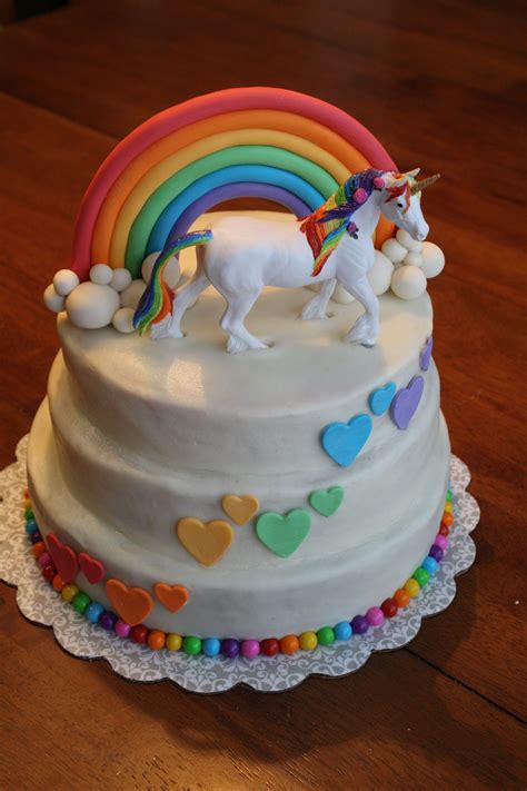 unicorn rainbow cake buttercream icing fondant rainbow and hearts sixlets around bottom the