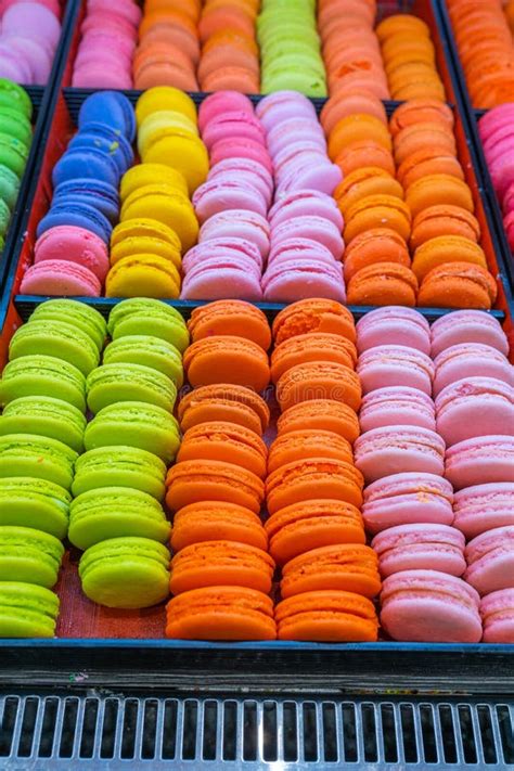 Pile Of Multicolored French Macaroon Cakes For Sale At Bakery Stock