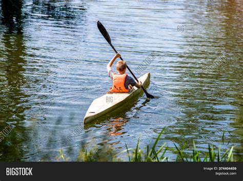 Youth Floating Canoe Image And Photo Free Trial Bigstock