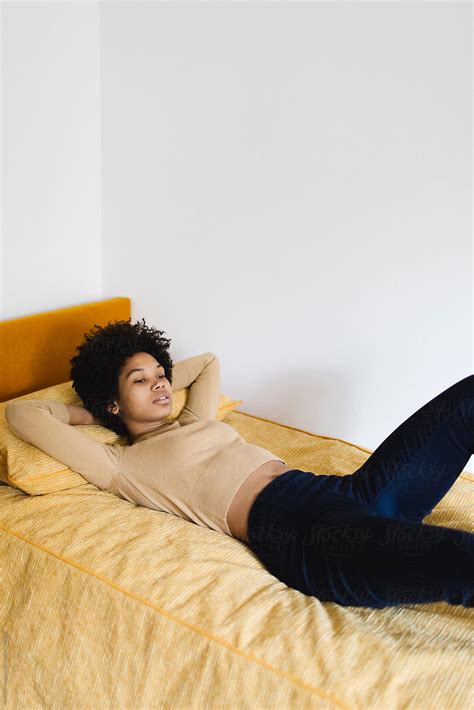 pretty woman lying on the bed by stocksy contributor michela ravasio stocksy