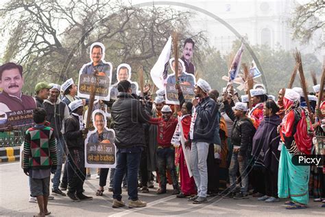 Image Of Aam Aadmi Party Aap Supporters Holding Cutout Of Arvind