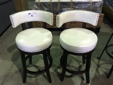 For your home bar, or wherever you wish t… PAIR OF WHITE LEATHER UPHOLSTERED & STUDDED SWIVEL BAR STOOLS