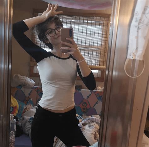 Nerdy Gal Taking A Mirror Selfie In A Tight White Top Fantastic Bra Outline R Bralines
