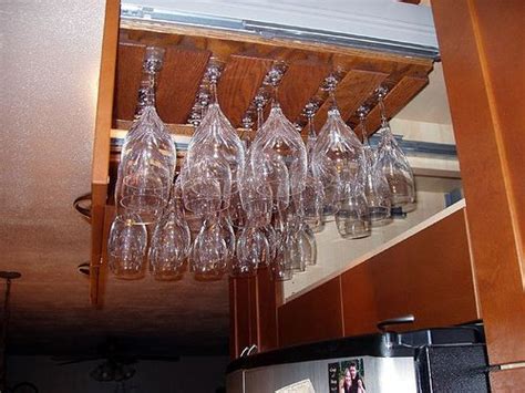 Helping to free up valuable cupboard space, this wine glass holder is perfect for storing and displaying up to 20 wine glasses. Great idea for wine glass storage, pull out hanging ...