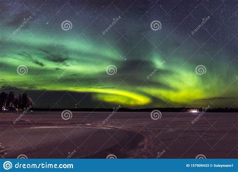 Northern Lights Near A Frozen Lake In Finland Stock Image