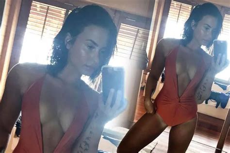 Demi Lovato Takes The Plunge In Sexy Orange Swimsuit As She Shows Off