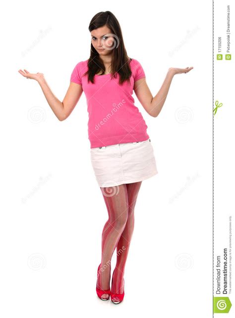 Teenage Girl Standing In Pink Clothes Shrugging Stock