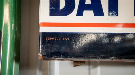 1954 delco batteries tin sign at elmer s auto and toy museum collection 2022 as f306 mecum auctions