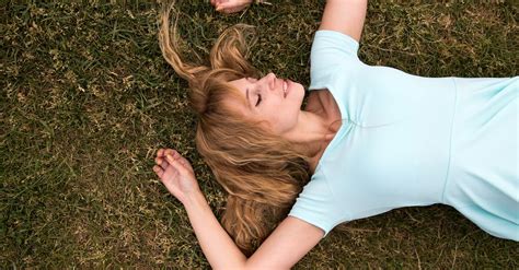 Woman Lying On Her Back On The Grass With Her Eyes Closed · Free Stock
