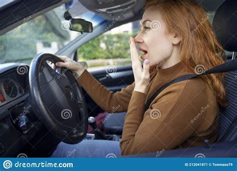 Portrait Of One Woman Feeling Sleepy And Driving Car Stock Image
