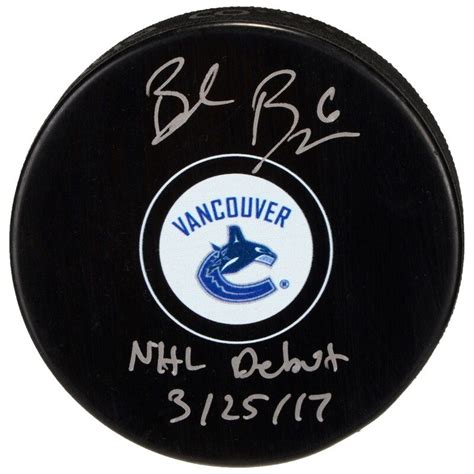 brock boeser vancouver canucks autographed hockey puck with nhl debut 3 25 17 inscription