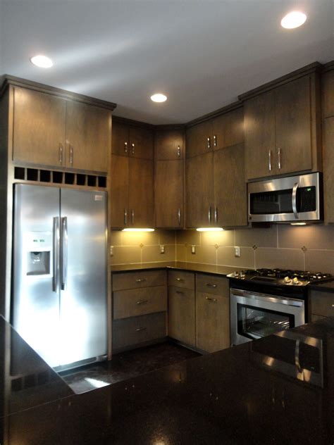 Contemporary Kitchen With Flat Panel Cabinet Doors Accentuated With