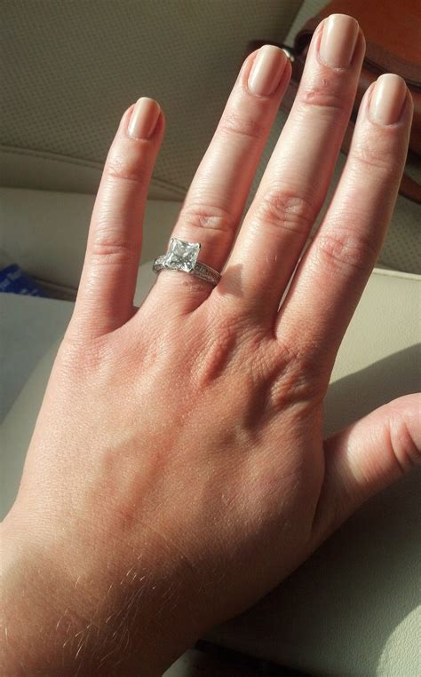 Wedding And Engagement Ring On Hand