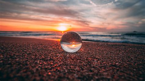 Download Wallpaper 2560x1440 Ball Glass Reflection Sea Sunset