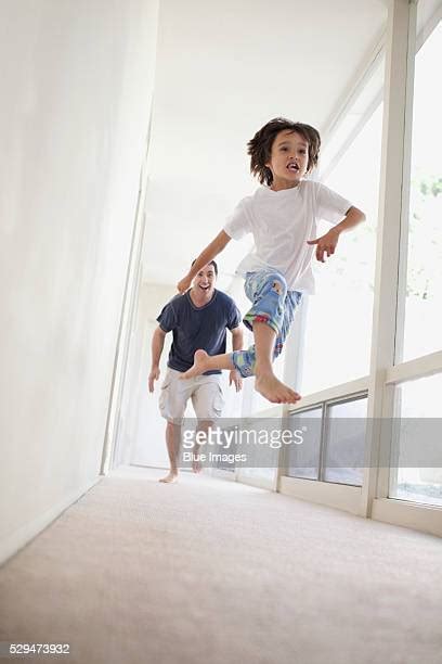 Father Chasing Kids Inside Photos And Premium High Res Pictures Getty