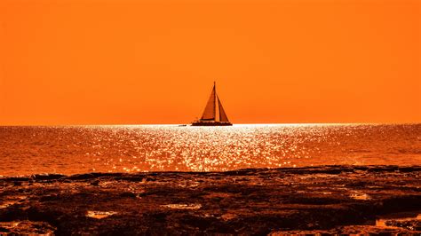 7680x4320 Sunset Boat Sail Orange Cloud And Sea 8k