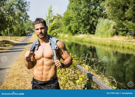 Muscular Shirtless Man Outdoor By Small River Stock Image Image Of