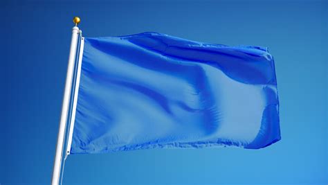 Empty White Clear Flag Waving In Slow Motion Against Blue Sky