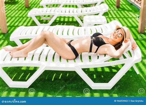 Woman Relaxing In Chaise Lounge At The Poolside Summer Relax Stock