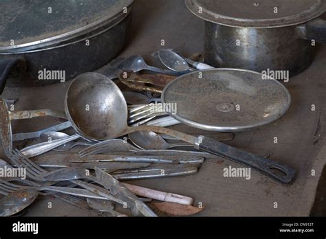 Rusty And Dirty Old Kitchen Utensils In A Long Abandoned Shack Stock