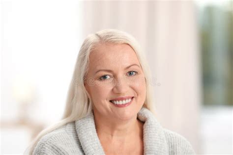 Portrait Of Beautiful Older Woman Against Blurred Stock Photo Image