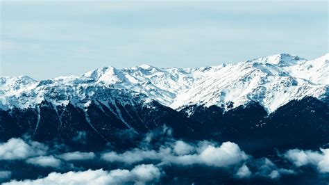 Download Wallpaper 1600x900 Mountains Fog Peaks Snowy Widescreen 16