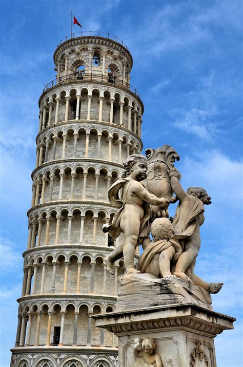 Leaning Tower Of Pisa And Cherub Statue In Pisa Italy Encircle Photos