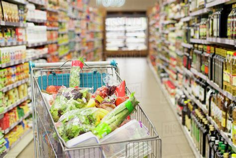 Close Up Of Full Shopping Cart In Grocery Store Stock Photo Dissolve