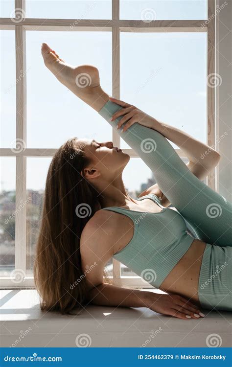 Slender Beautiful Adult Girl Doing Stretching Indoor Stock Image