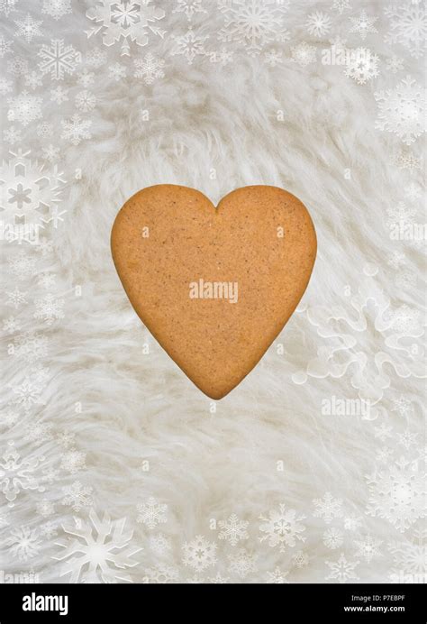 Heartshaped Gingerbread Cookie On Fluffy White Furry Sheepskin And