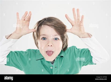 Boy 8 9 Pulling Funny Faces Close Up Portrait Stock Photo Alamy