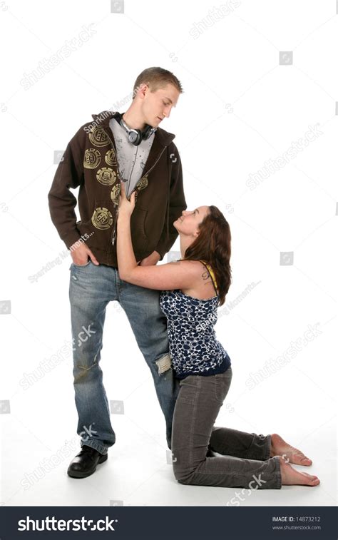 Woman On Her Knees Looking Up At Her Grunge Boyfriend Stock Photo