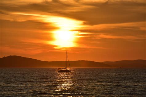 Wallpaper Sailboat Boat Sea Sunset Glare Hd