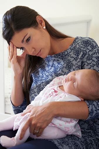 Tired Mother Suffering From Post Natal Depression Stock Photo