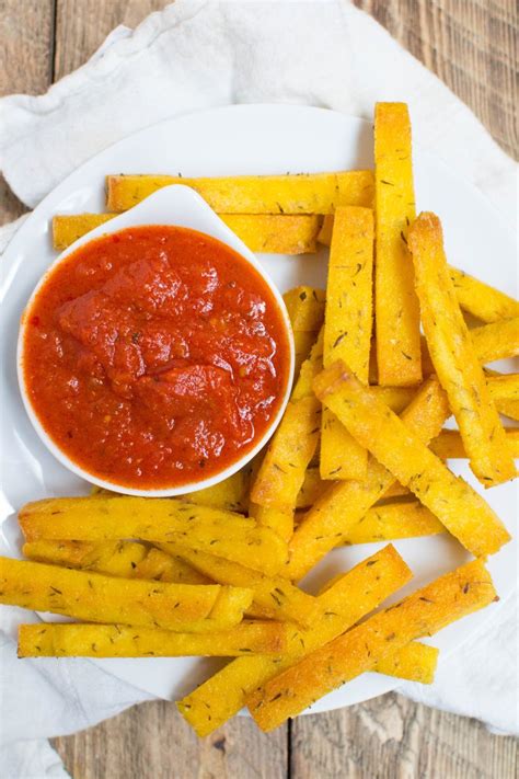 Crispy baked polenta fries are exactly the delicious and easy nosh you need for your next gathering. Cheesy Polenta Fries
