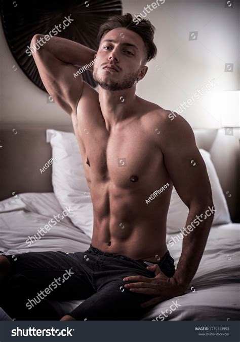 shirtless sexy male model lying alone foto stok 1239113953 shutterstock