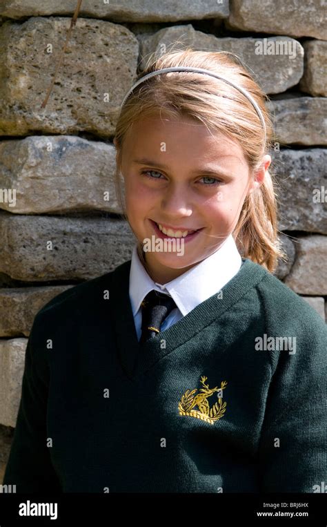 Portrait Of A Smiling Schoolgirl Wearing School Uniform Stock Photo Alamy