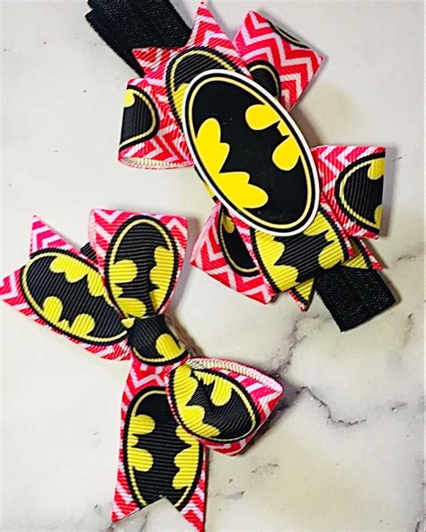 There Are 2 BatGirl Bow Sets On The Website