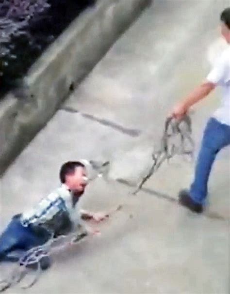 Chinese Father Punishes Son By Dragging Him Along With Rope Around His