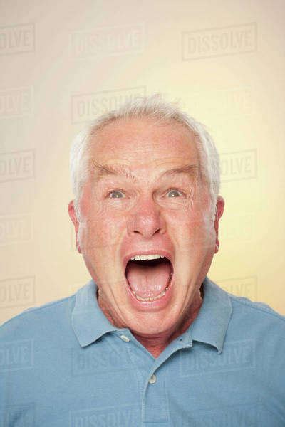 Portrait Of Senior Man Screaming Stock Photo Dissolve