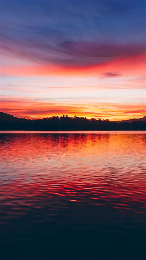Download Wallpaper 938x1668 Lake Sunset Horizon Sky Trees Twilight